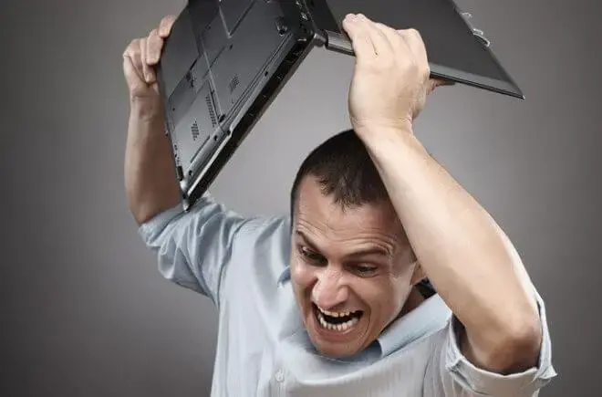 Photodune 598494 angry businessman smashing his laptop s