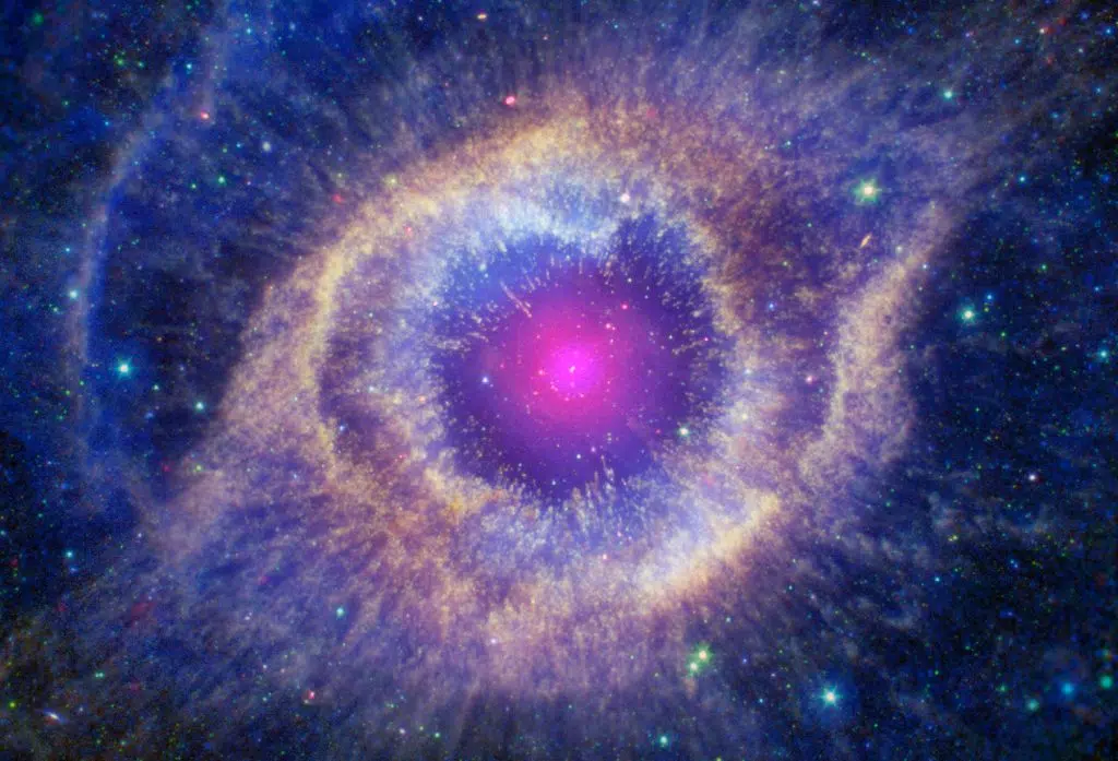 Nebulosa planetária de hélice. Uma estrela anã branca se formou no centro da nebulosa em rosa. Ao redor, alguns cinturões em tons de azul, roxo, amarelo e rosa.