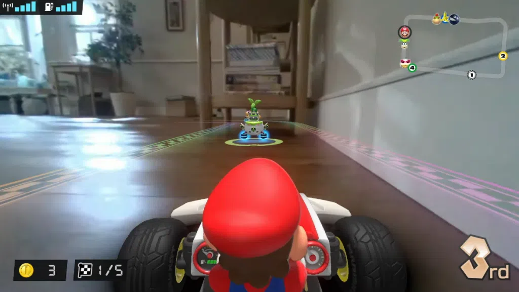 Captura de tela do novo mario kart, onde o jogador assumirá o controle de um carrinho de verdade e a pista será na sua casa