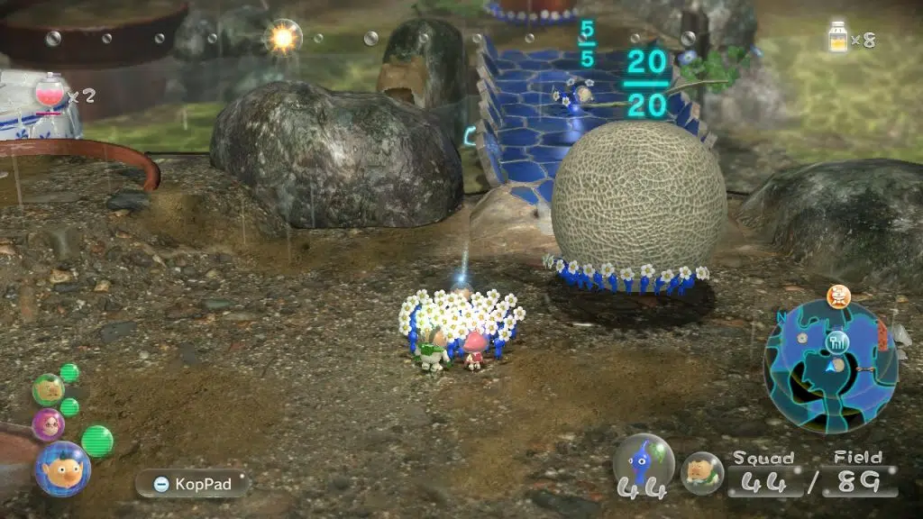 Pikmin carregam um melão após derrotarem um chefe.